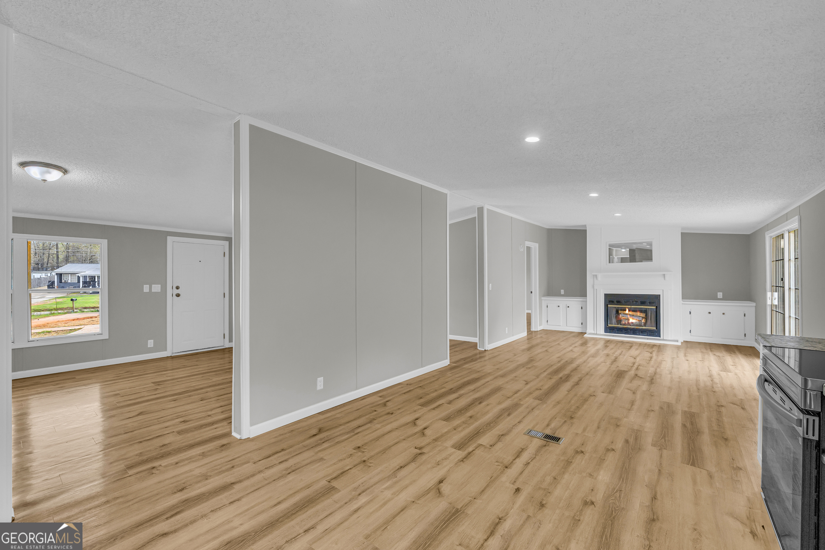199 Alberta Drive Colbert, GA 30628 - Photo 22 of 39 a view of empty room with wooden floor and window