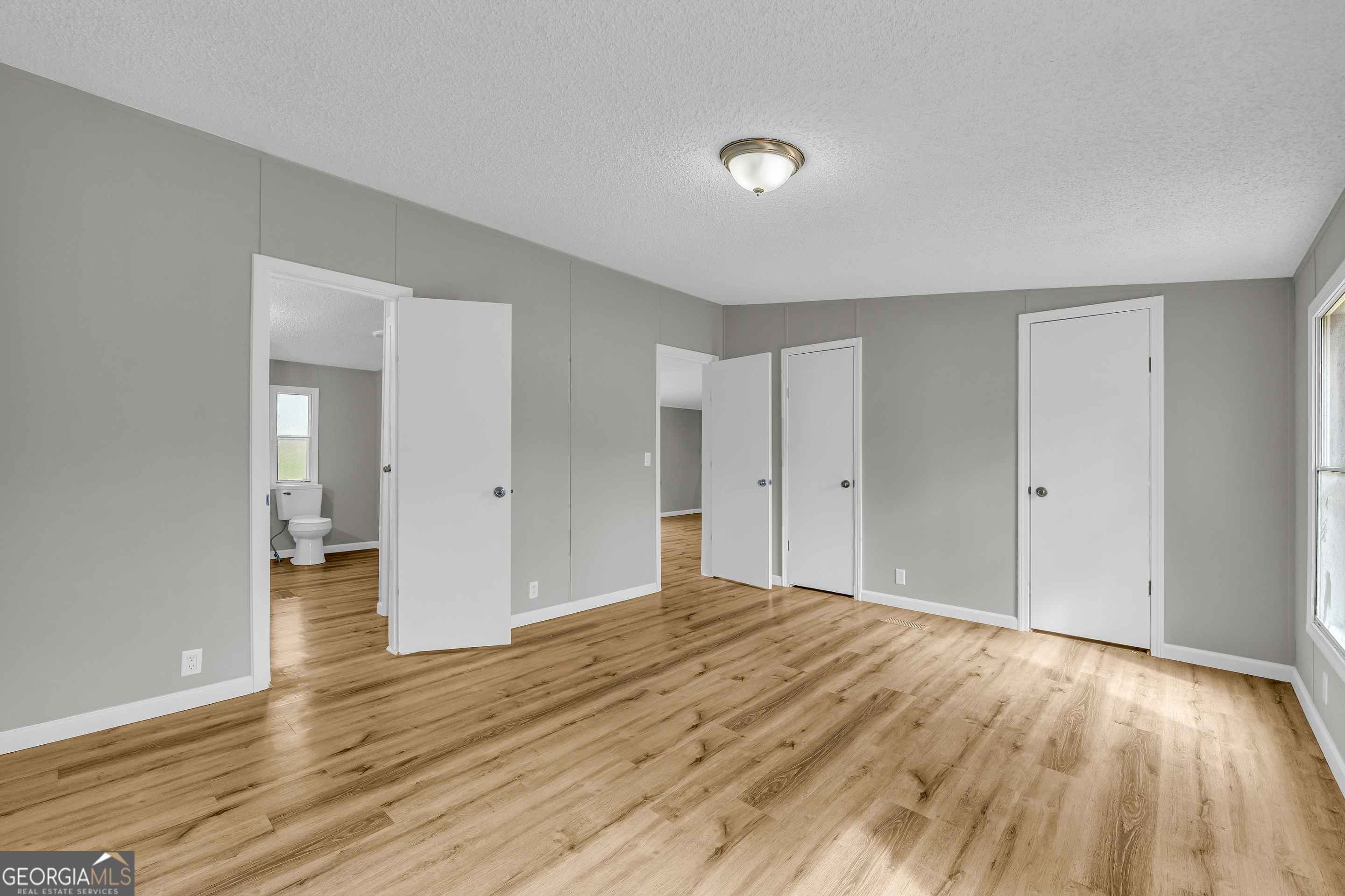 199 Alberta Drive Colbert, GA 30628 - Photo 24 of 39 a view of empty room with wooden floor