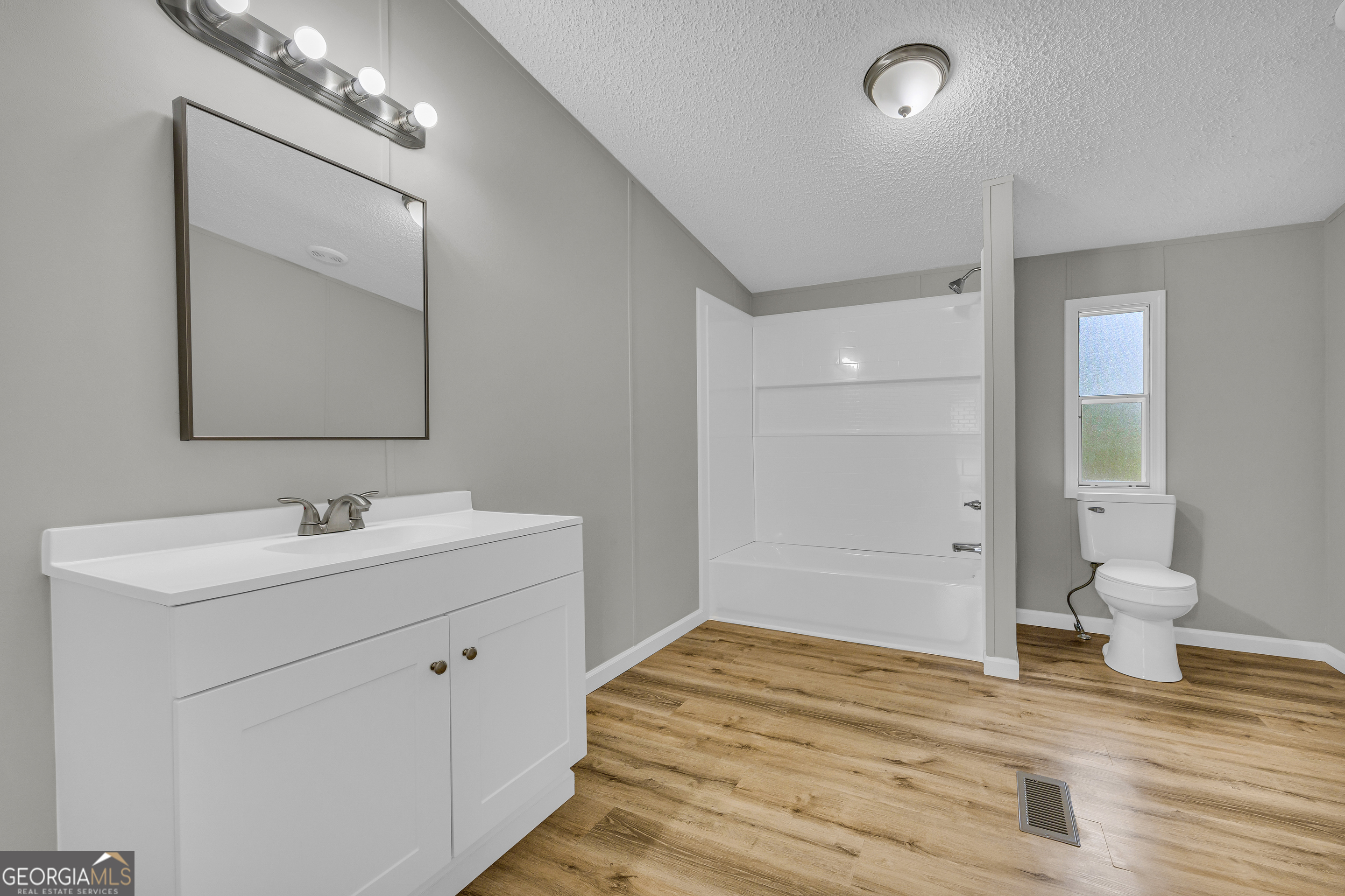 199 Alberta Drive Colbert, GA 30628 - Photo 26 of 39 a bathroom with a sink and a toilet