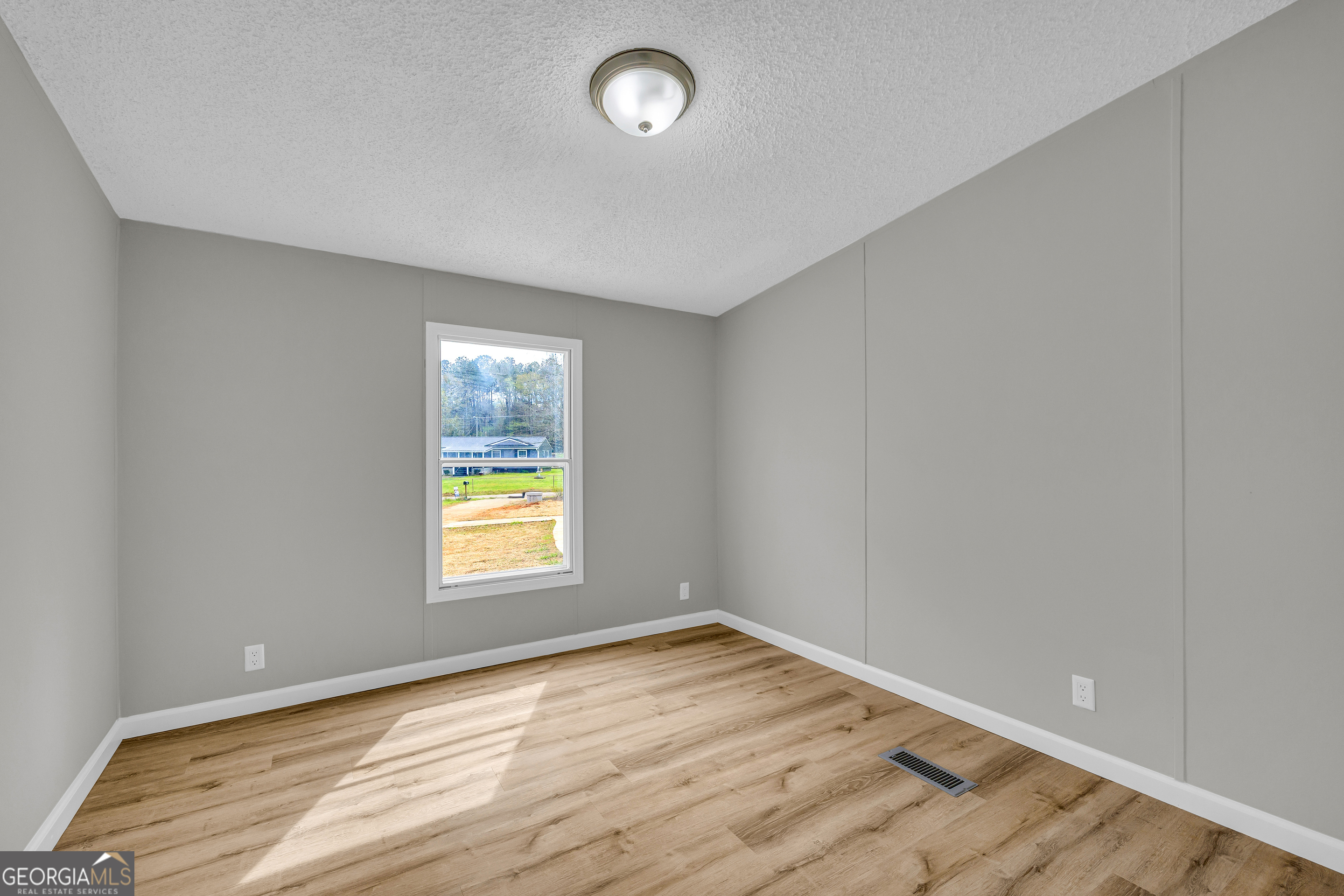 199 Alberta Drive Colbert, GA 30628 - Photo 33 of 39 a view of an empty room and window