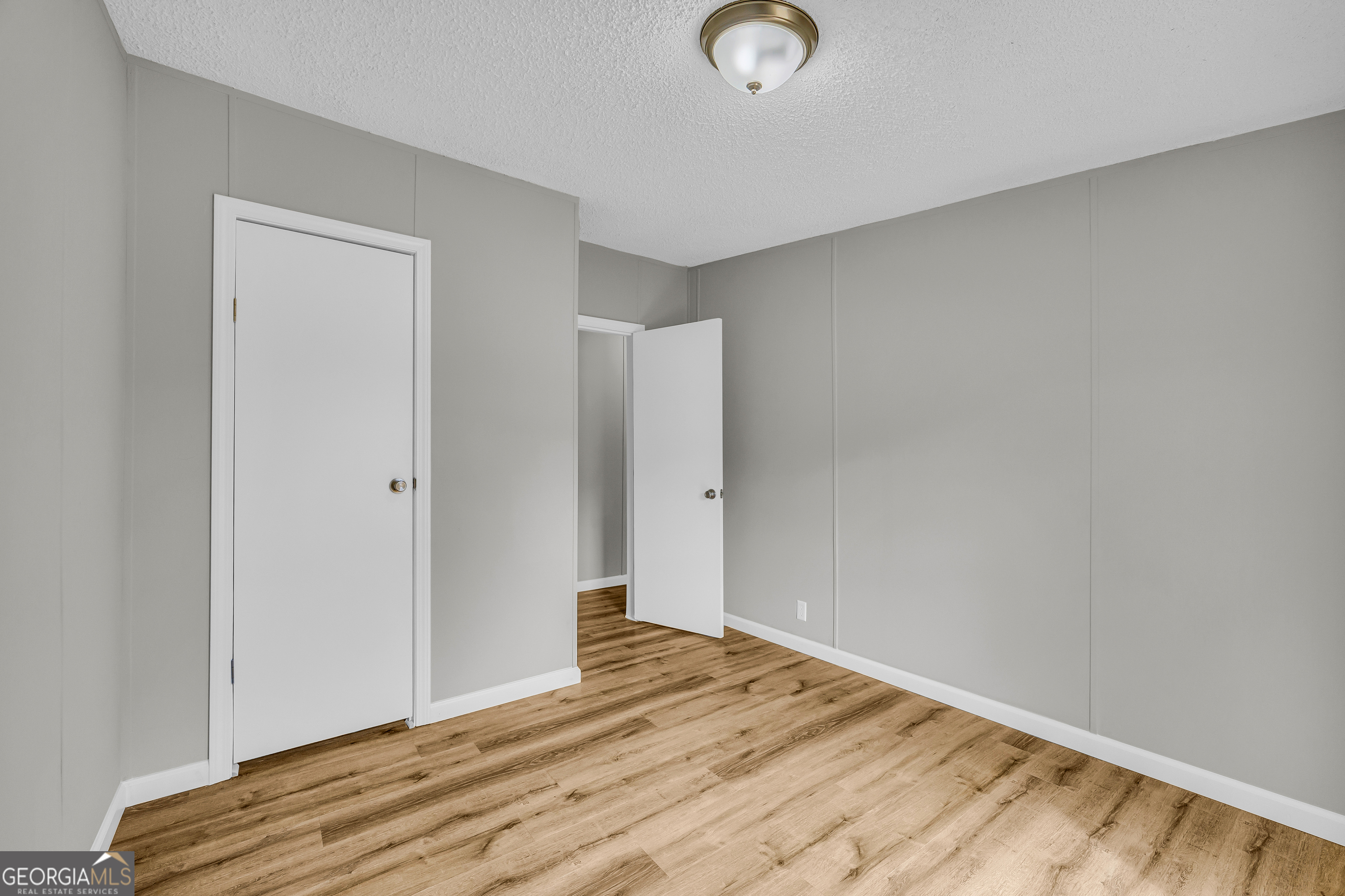 199 Alberta Drive Colbert, GA 30628 - Photo 34 of 39 a view of a room with wooden floor and bathroom