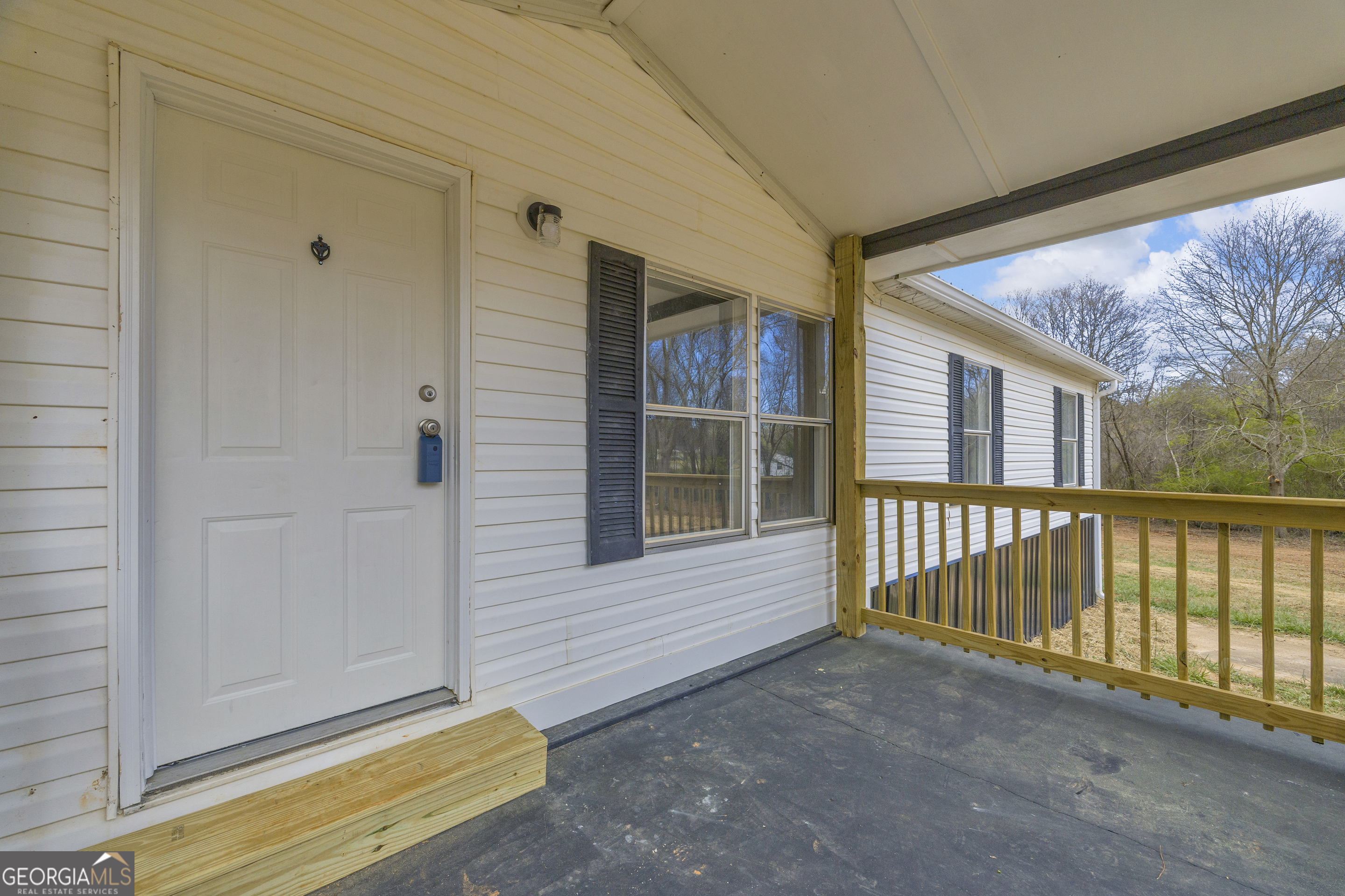 199 Alberta Drive Colbert, GA 30628 - Photo 7 of 39 a view of a house with a backyard
