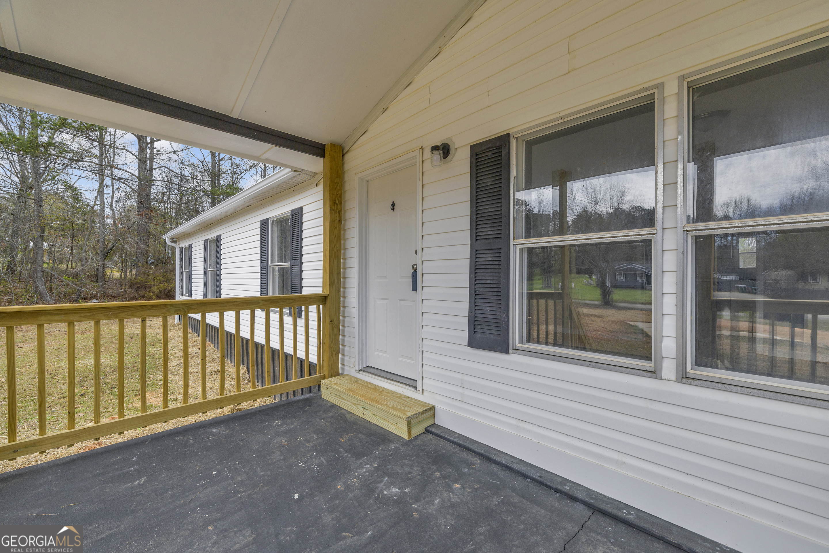 199 Alberta Drive Colbert, GA 30628 - Photo 8 of 39 a view of a house with a porch