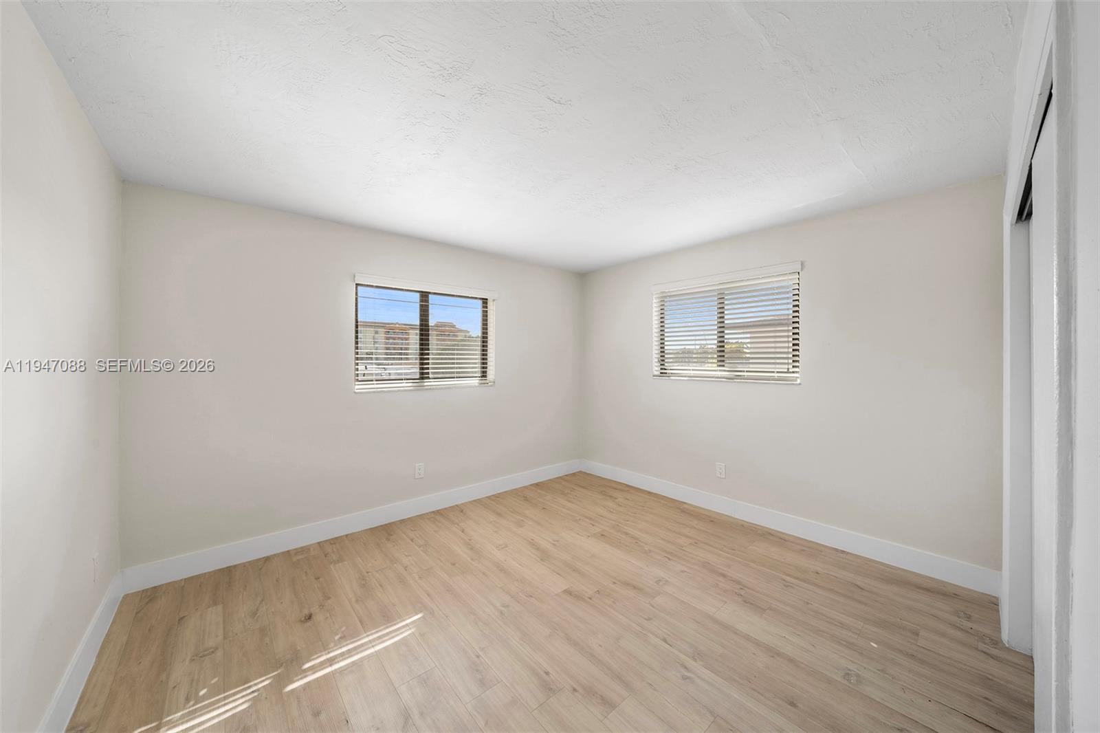 1330 West 29th Street, Unit 35 Hialeah, FL 33012 - Photo 7 of 16 an empty room with a window