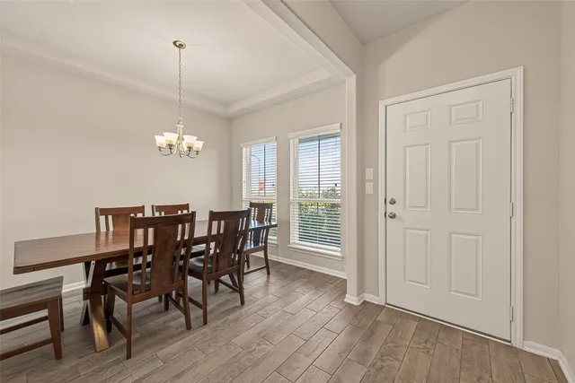 a large kitchen with stainless steel appliances granite countertop a stove sink and cabinets