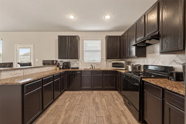 a bathroom with a sink a vanity and a mirror