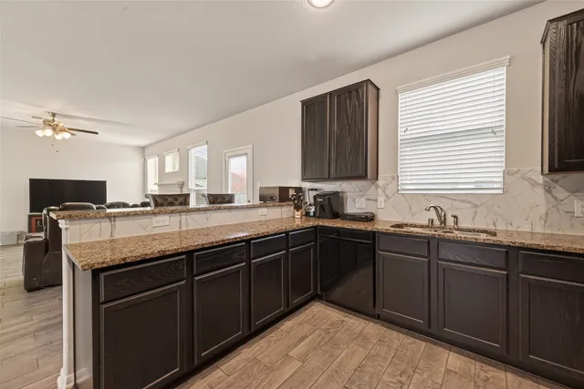 a bathroom with a shower and a sink