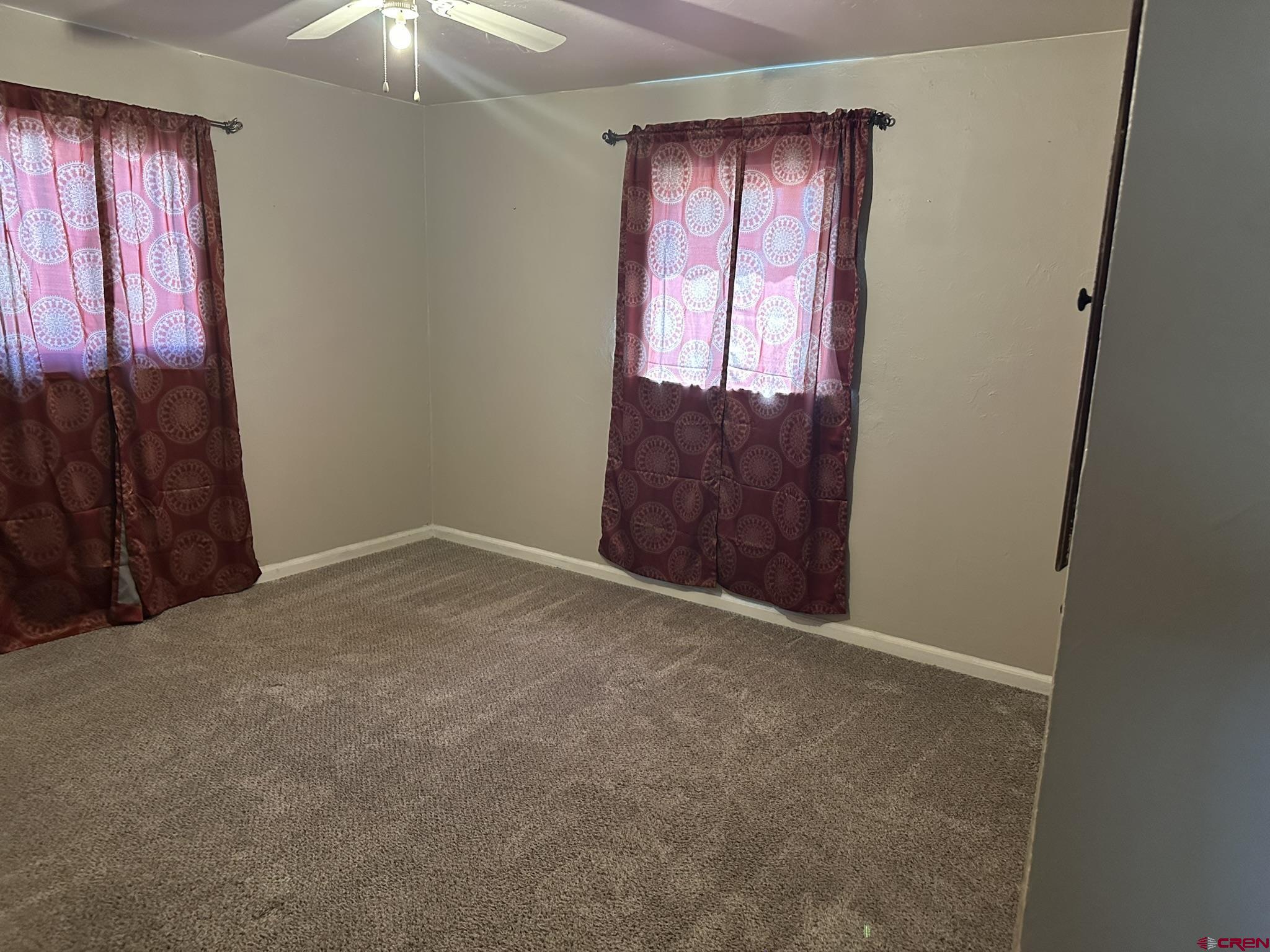 435 South Elm Street Cortez, CO 81321 - Photo 11 of 17 an empty room with windows and closet