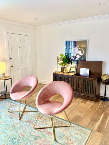 a living room with furniture and a rug