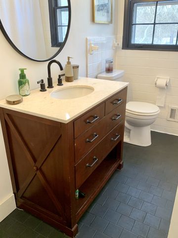a bathroom with a sink and a mirror