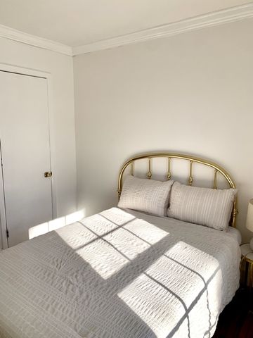 a bedroom with a bed and with mirror