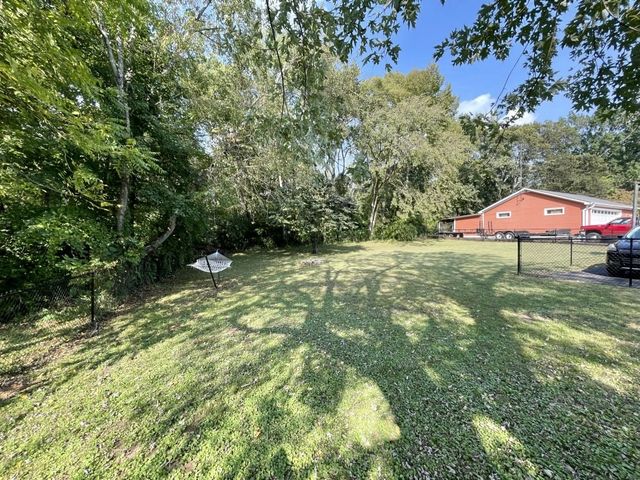 a backyard of a house with lots of green space