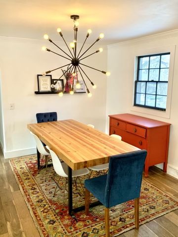 a bedroom with a bed and a table