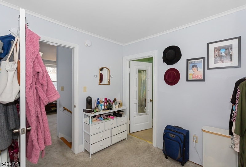 826 Sigsbee Avenue Alpha, NJ 08865 - Photo 13 of 38 a bedroom with a bed and cabinets