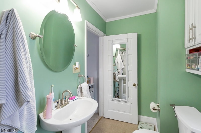 826 Sigsbee Avenue Alpha, NJ 08865 - Photo 15 of 38 a bathroom with a sink mirror and toilet