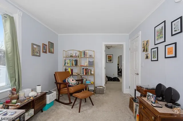 a living room with furniture and windows
