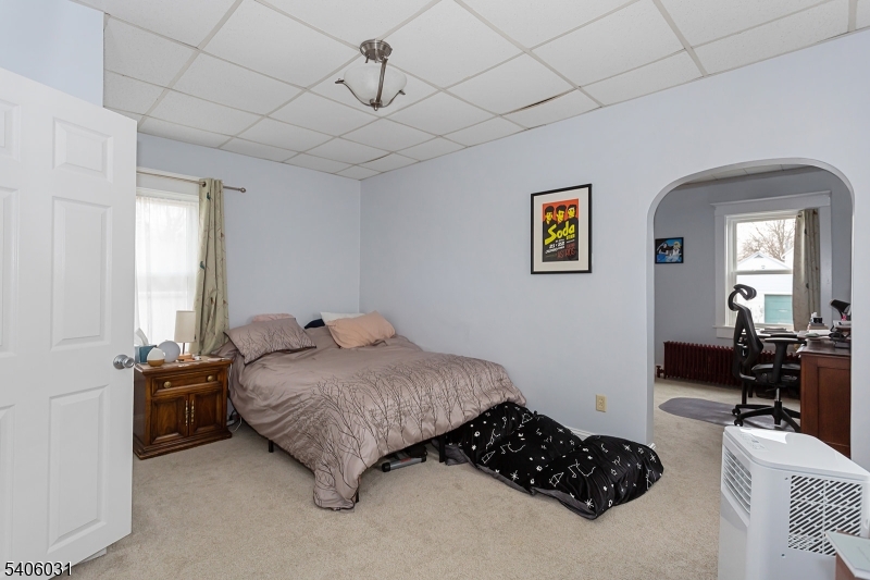 826 Sigsbee Avenue Alpha, NJ 08865 - Photo 18 of 38 a bedroom with a bed mirror and window