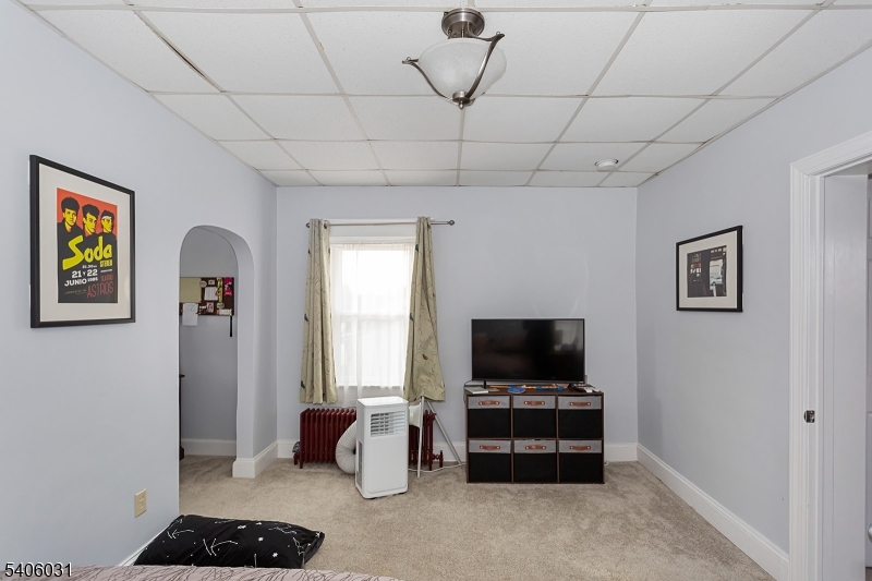 826 Sigsbee Avenue Alpha, NJ 08865 - Photo 20 of 38 a living room with furniture and a flat screen tv