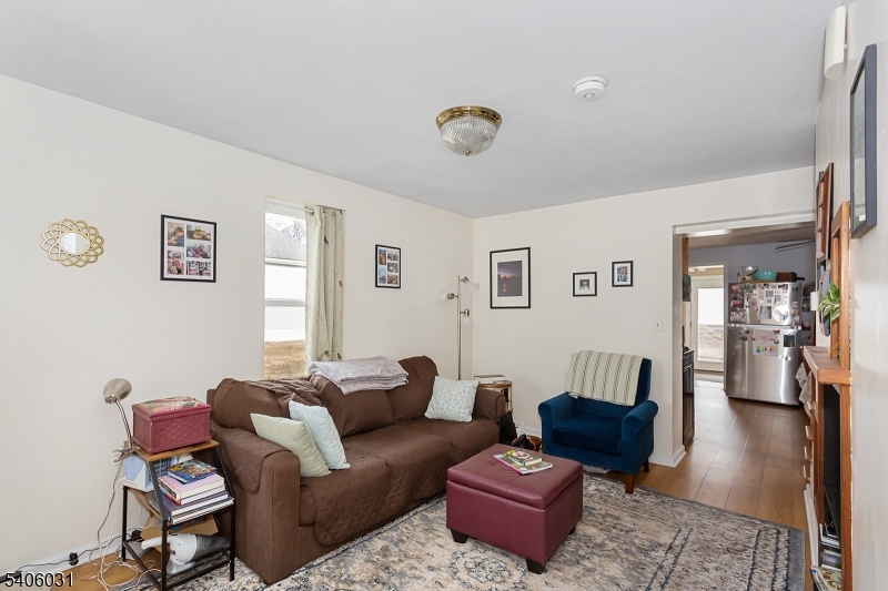 826 Sigsbee Avenue Alpha, NJ 08865 - Photo 2 of 38 a living room with furniture or couch and a wooden floor