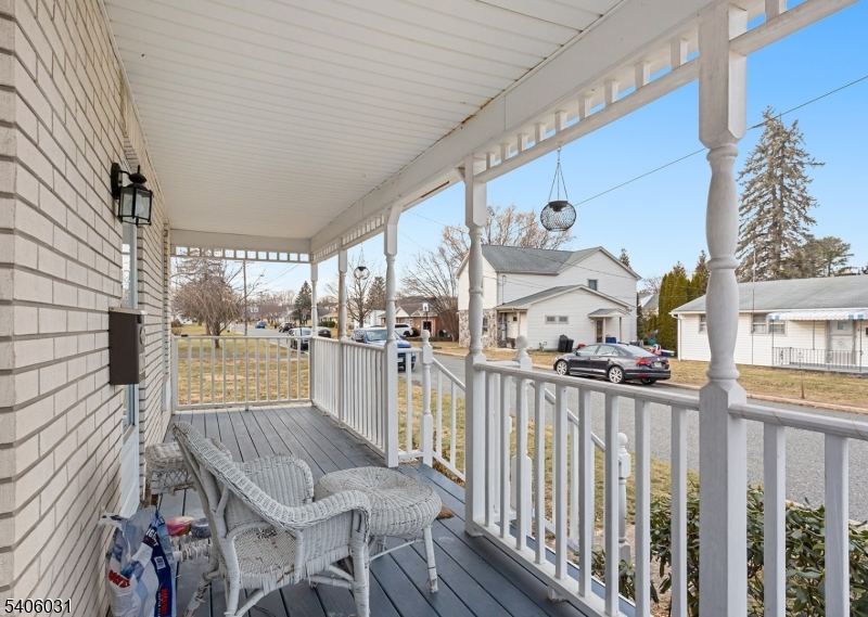 826 Sigsbee Avenue Alpha, NJ 08865 - Photo 28 of 38 a view of a patio with table and chairs with wooden floor and fence