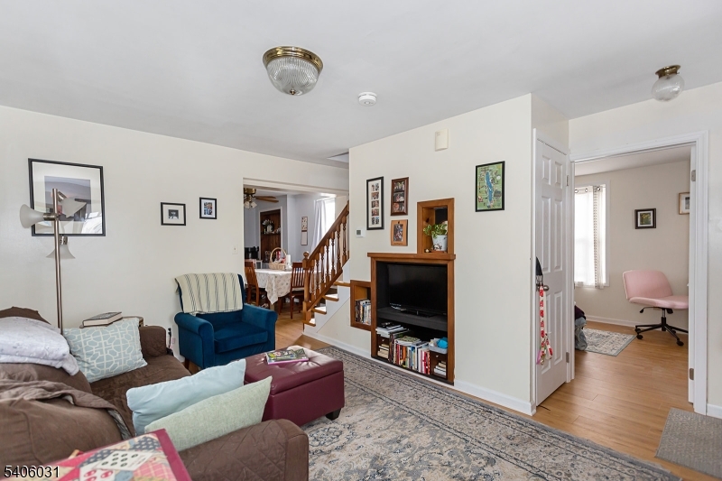 826 Sigsbee Avenue Alpha, NJ 08865 - Photo 4 of 38 a living room with furniture and a flat screen tv