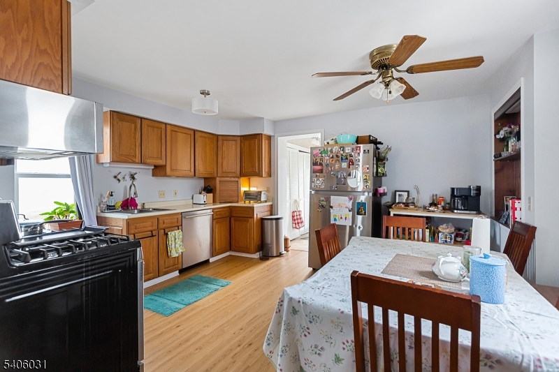 826 Sigsbee Avenue Alpha, NJ 08865 - Photo 5 of 38 a kitchen with stainless steel appliances kitchen island granite countertop a sink stove and refrigerator