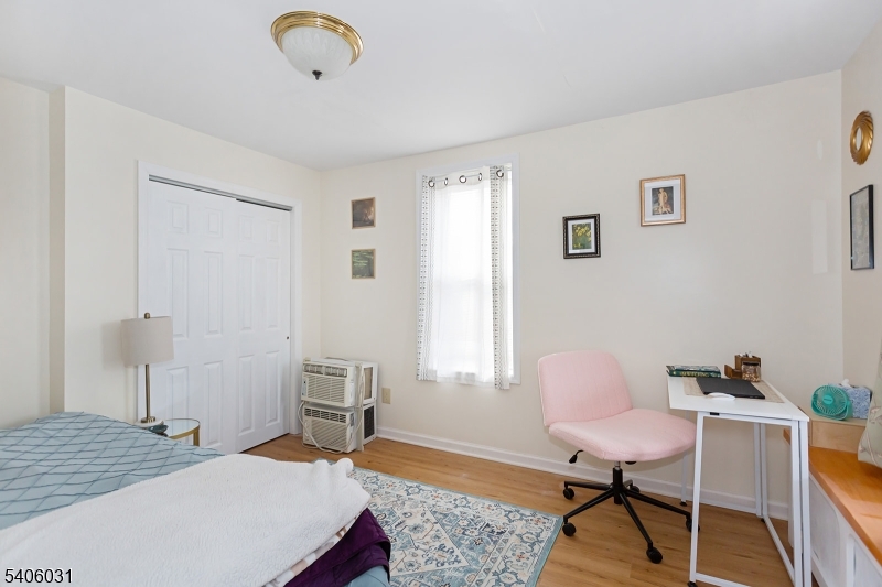 826 Sigsbee Avenue Alpha, NJ 08865 - Photo 8 of 38 a bedroom with a bed and a chair