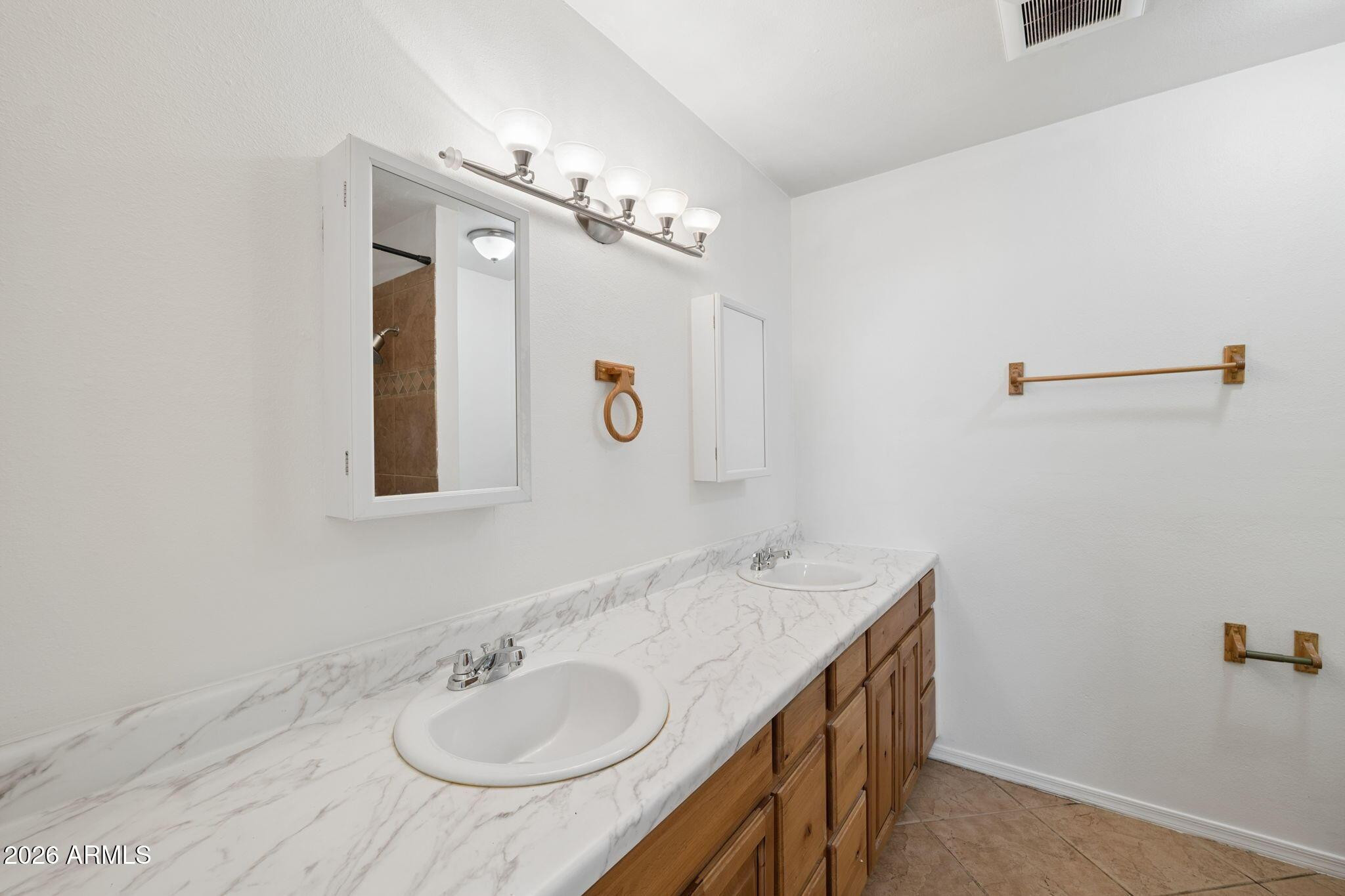 7 South Catalina Street Gilbert, AZ 85233 - Photo 14 of 34 a bathroom with a sink a vanity and a mirror