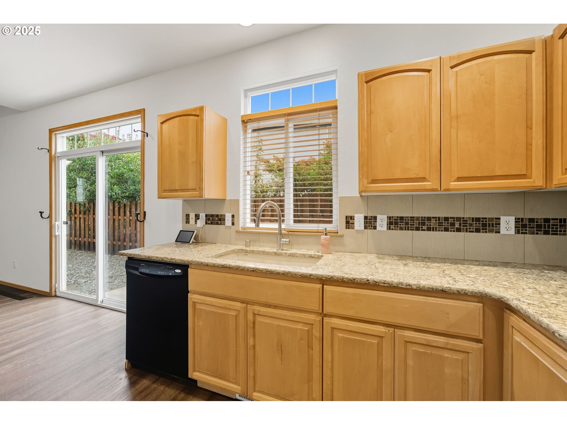 3207 Southeast 194th Court Camas, WA 98607 - Photo 17 of 41 a kitchen with granite countertop a sink and a window