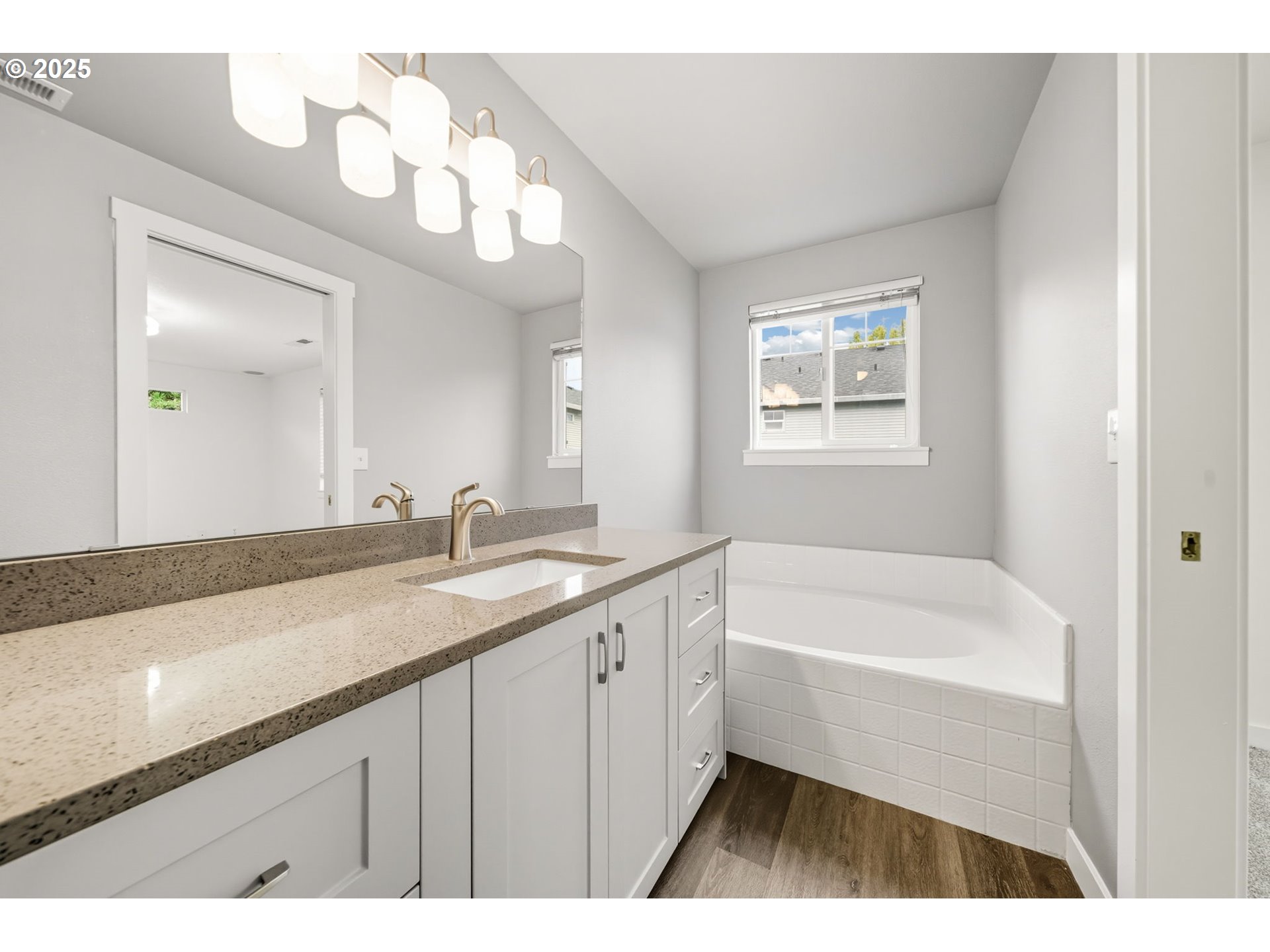 3207 Southeast 194th Court Camas, WA 98607 - Photo 23 of 41 a bathroom with a sink a large mirror and a bathtub