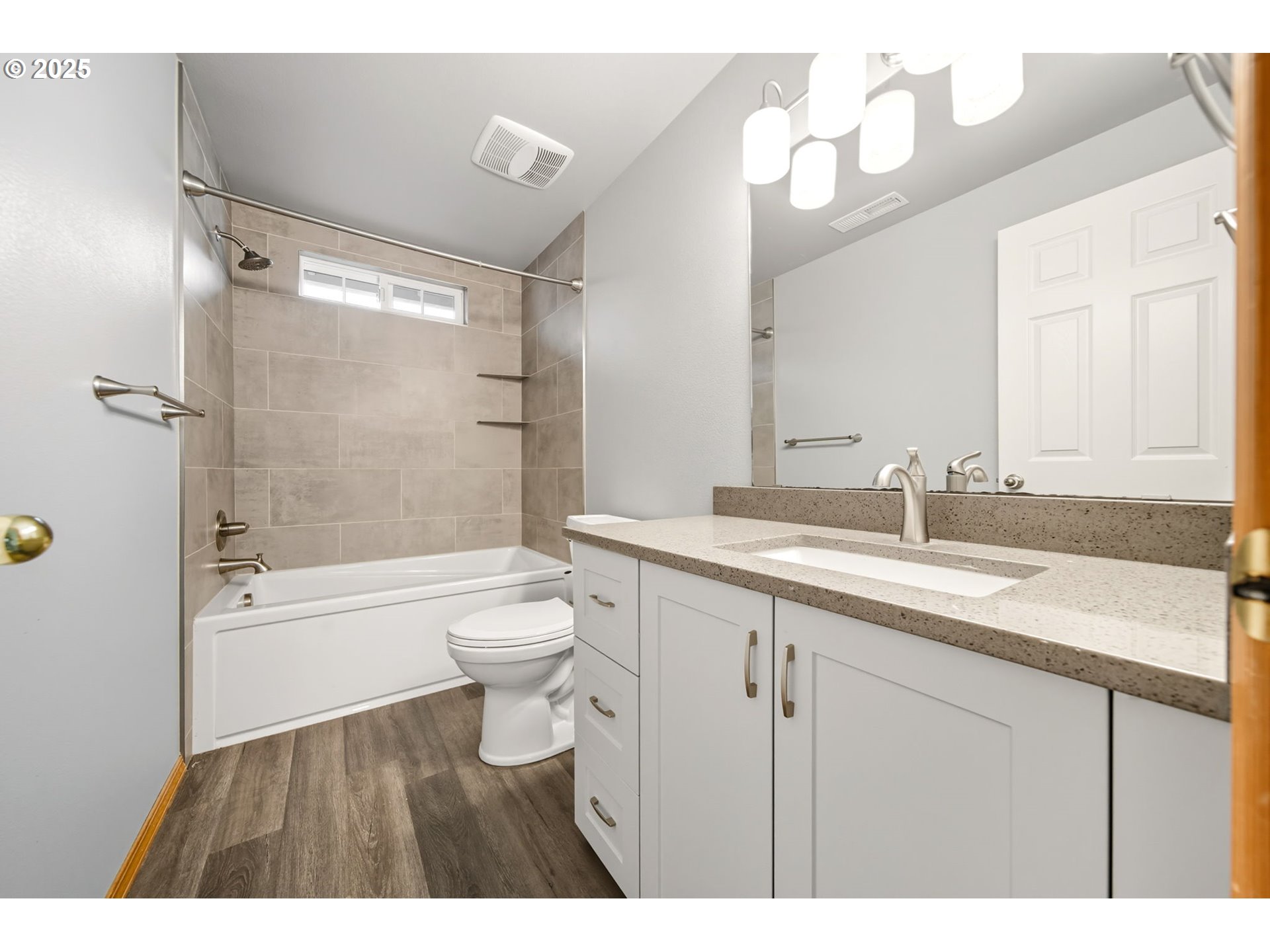 3207 Southeast 194th Court Camas, WA 98607 - Photo 29 of 41 a bathroom with a granite countertop sink toilet a shower and a bathtub
