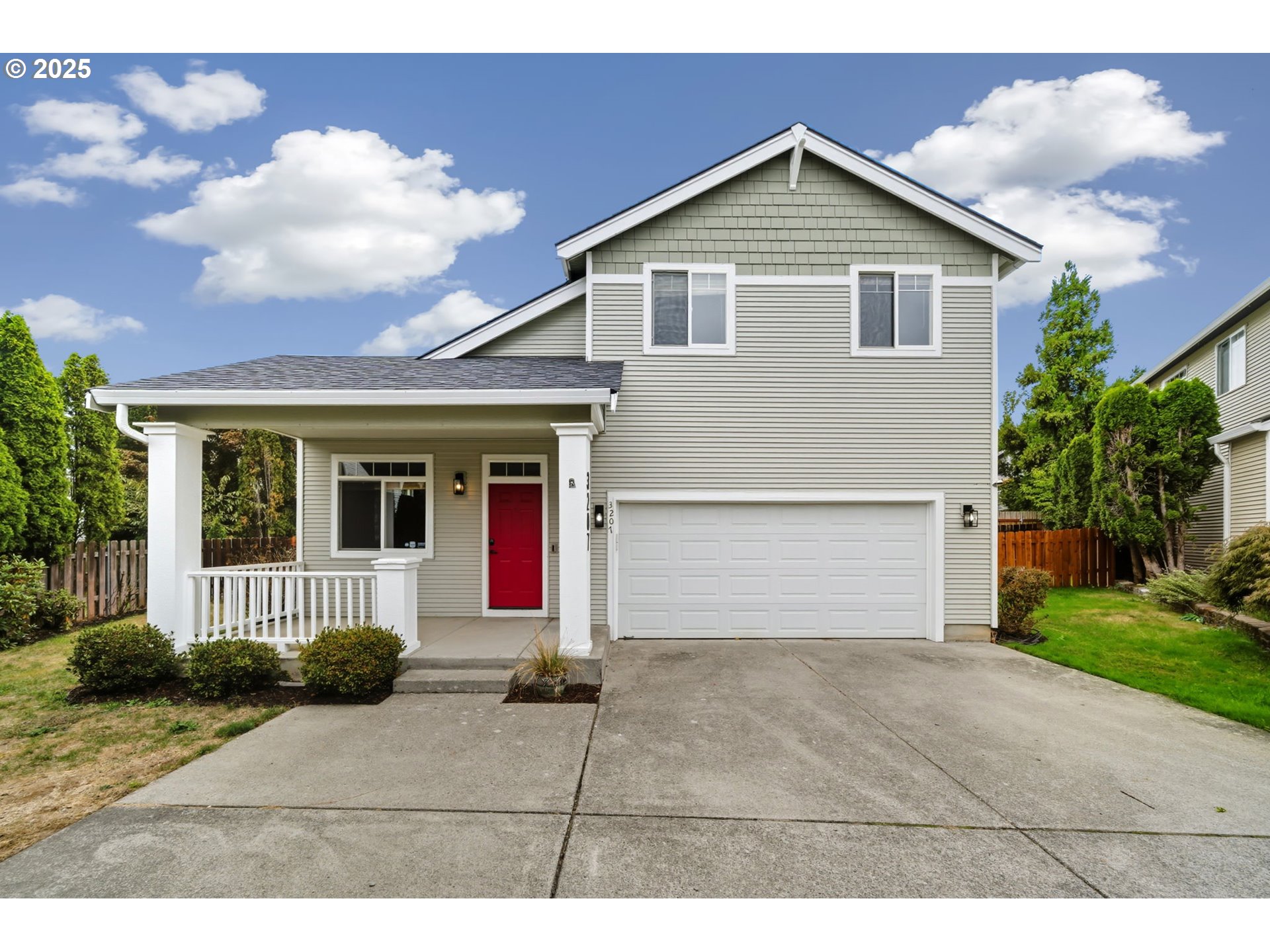 3207 Southeast 194th Court Camas, WA 98607 - Photo 41 of 41 a front view of a house with a yard and garage