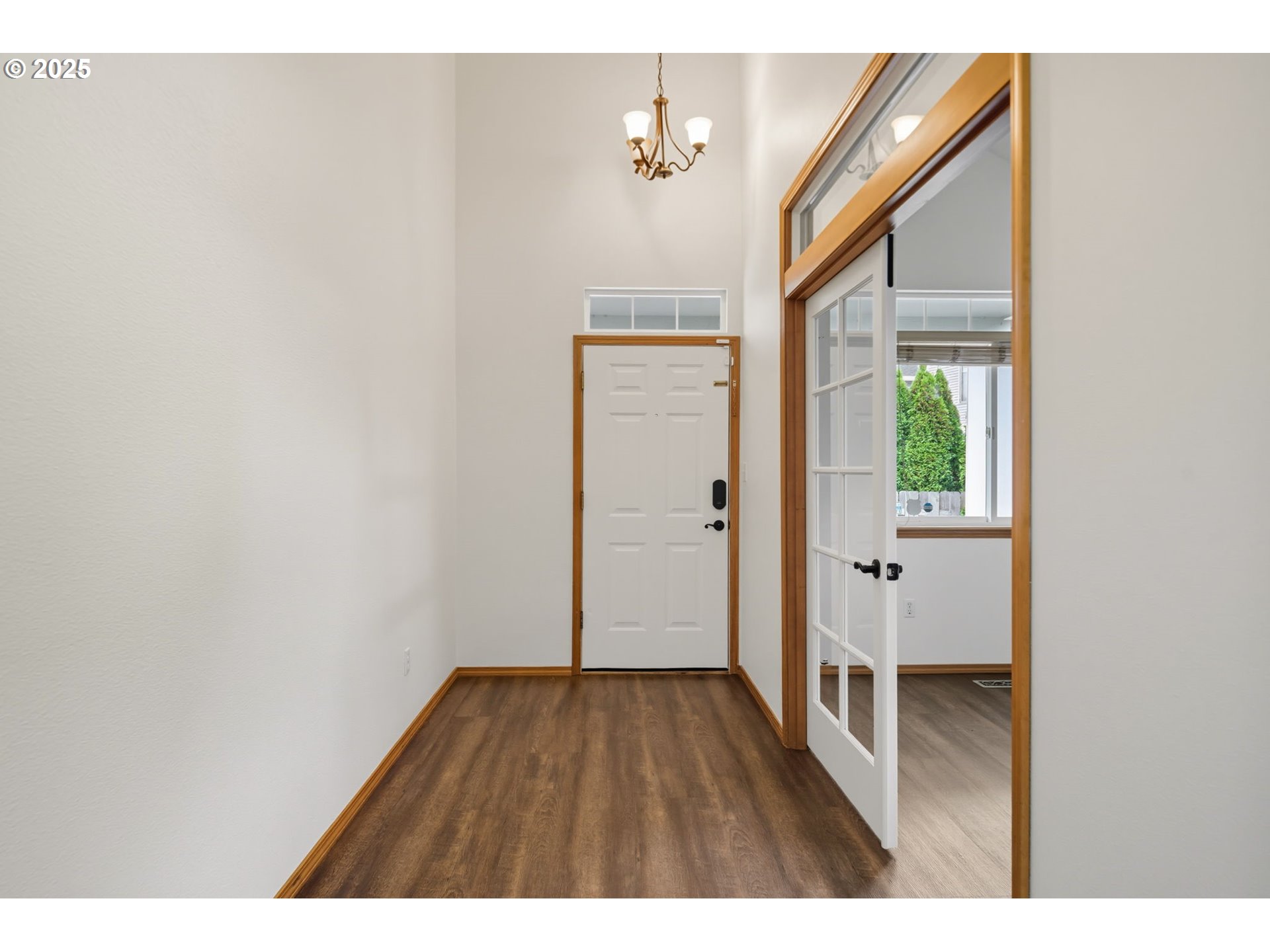 3207 Southeast 194th Court Camas, WA 98607 - Photo 6 of 41 a view of an empty room with wooden floor and a window