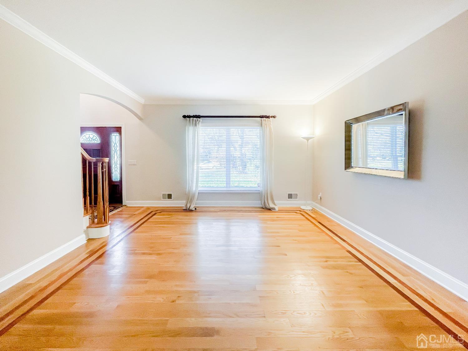 11 Edgebrook Road New Brunswick, NJ 08901 - Photo 15 of 42 a view of empty room with wooden floor and fan