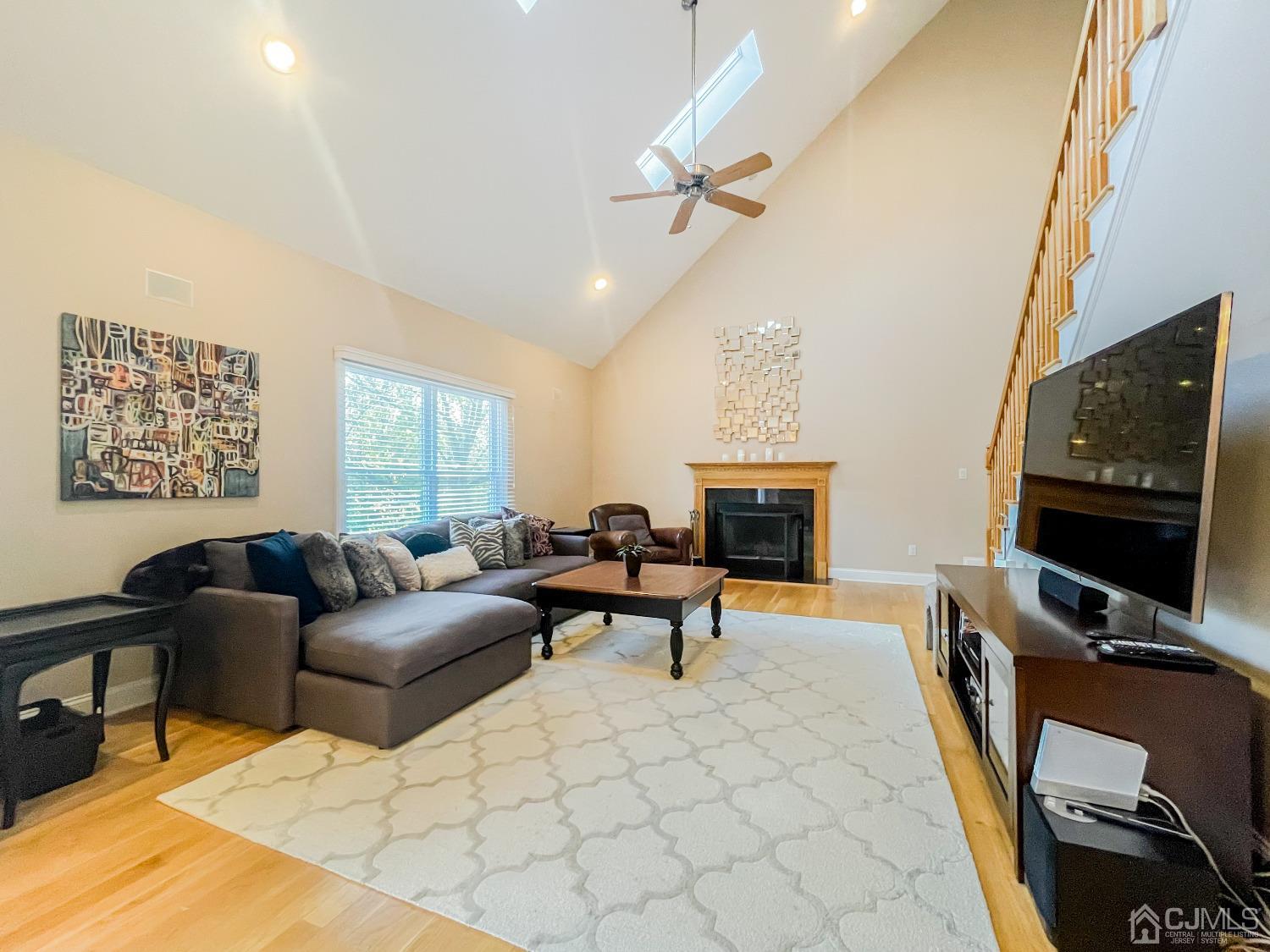 11 Edgebrook Road New Brunswick, NJ 08901 - Photo 22 of 42 a living room with furniture a flat screen tv and a window