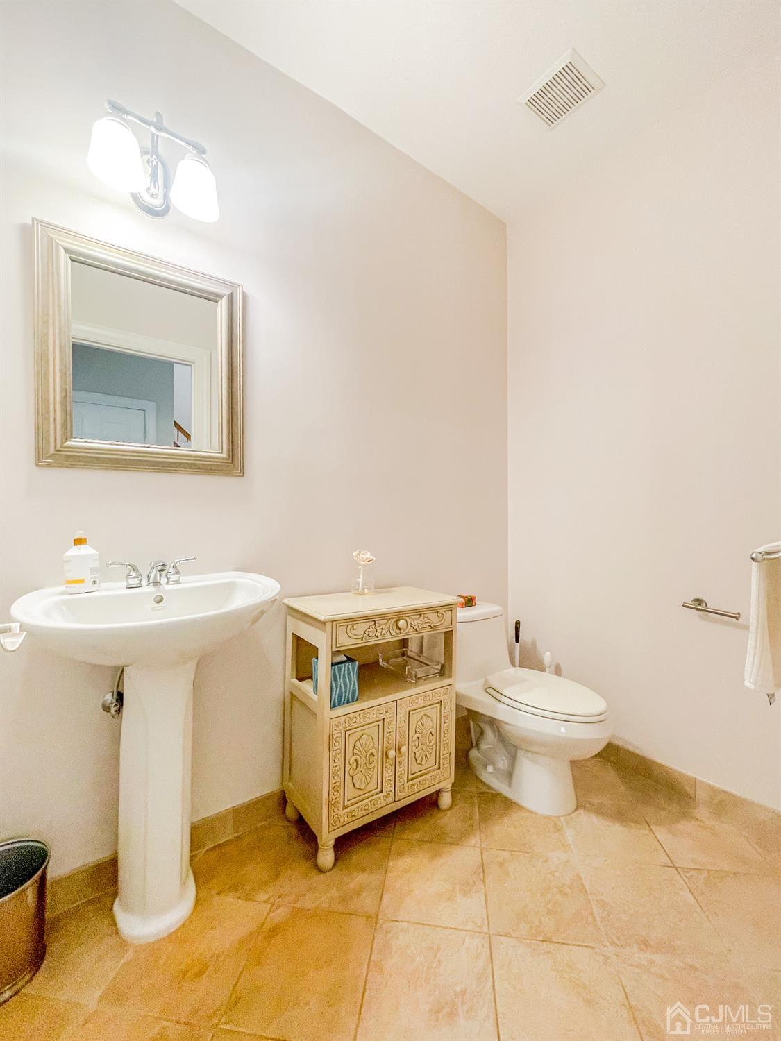 11 Edgebrook Road New Brunswick, NJ 08901 - Photo 24 of 42 a spacious bathroom with a sink and a mirror