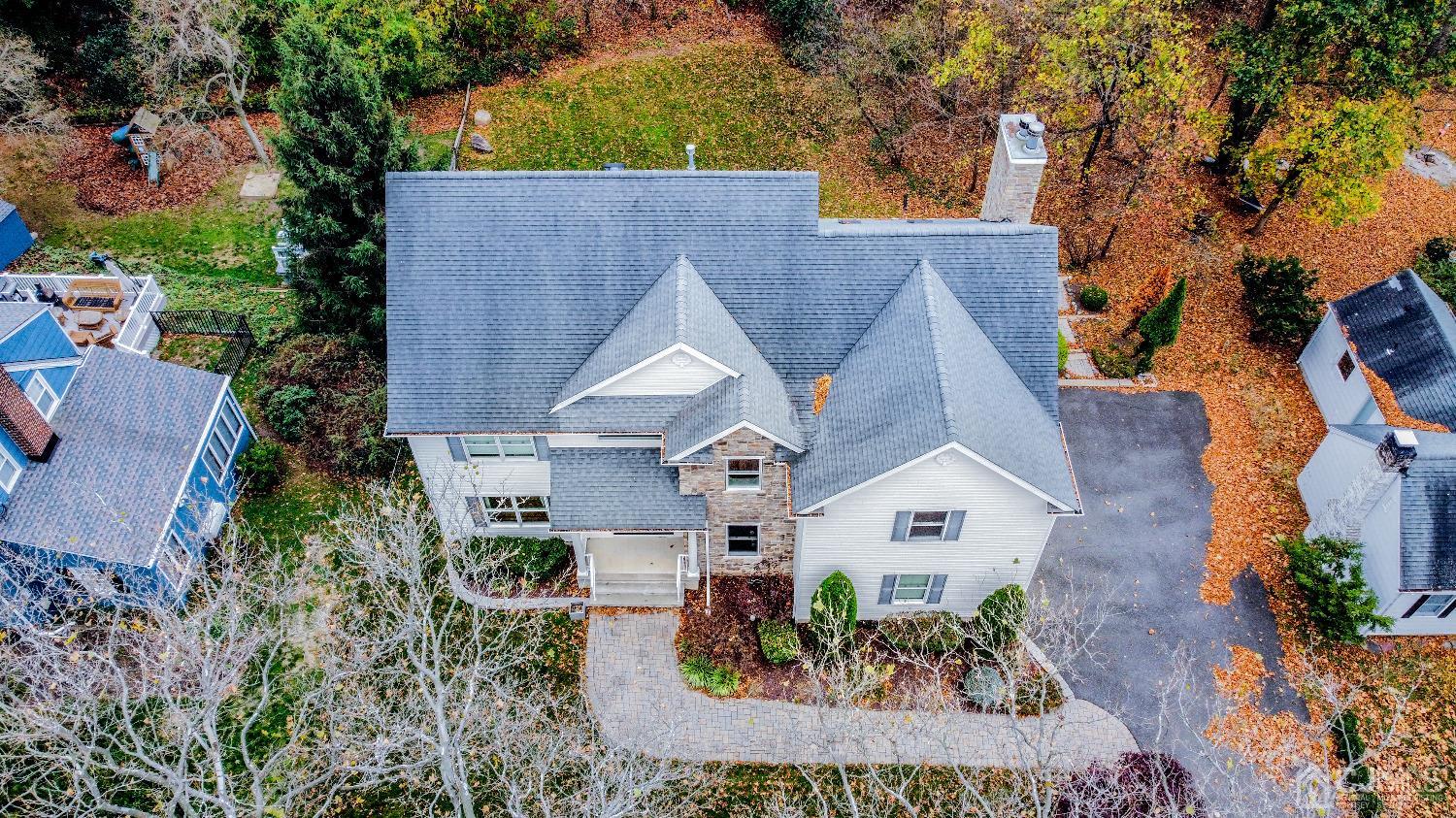 11 Edgebrook Road New Brunswick, NJ 08901 - Photo 4 of 42 an aerial view of a house with a yard and large tree