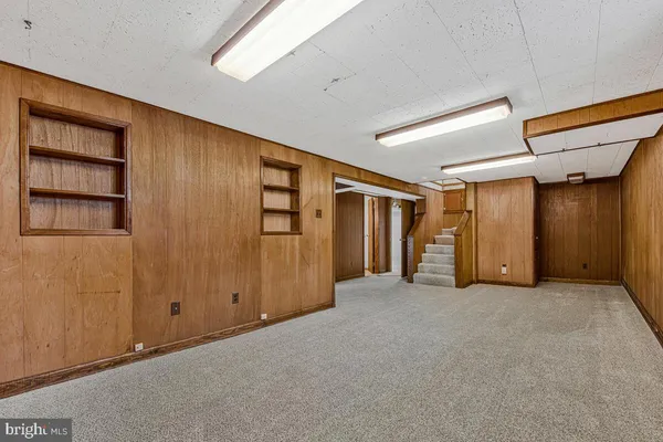 an empty room with closet area