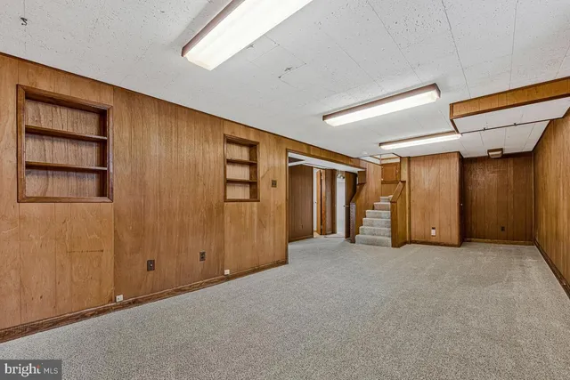 an empty room with closet area