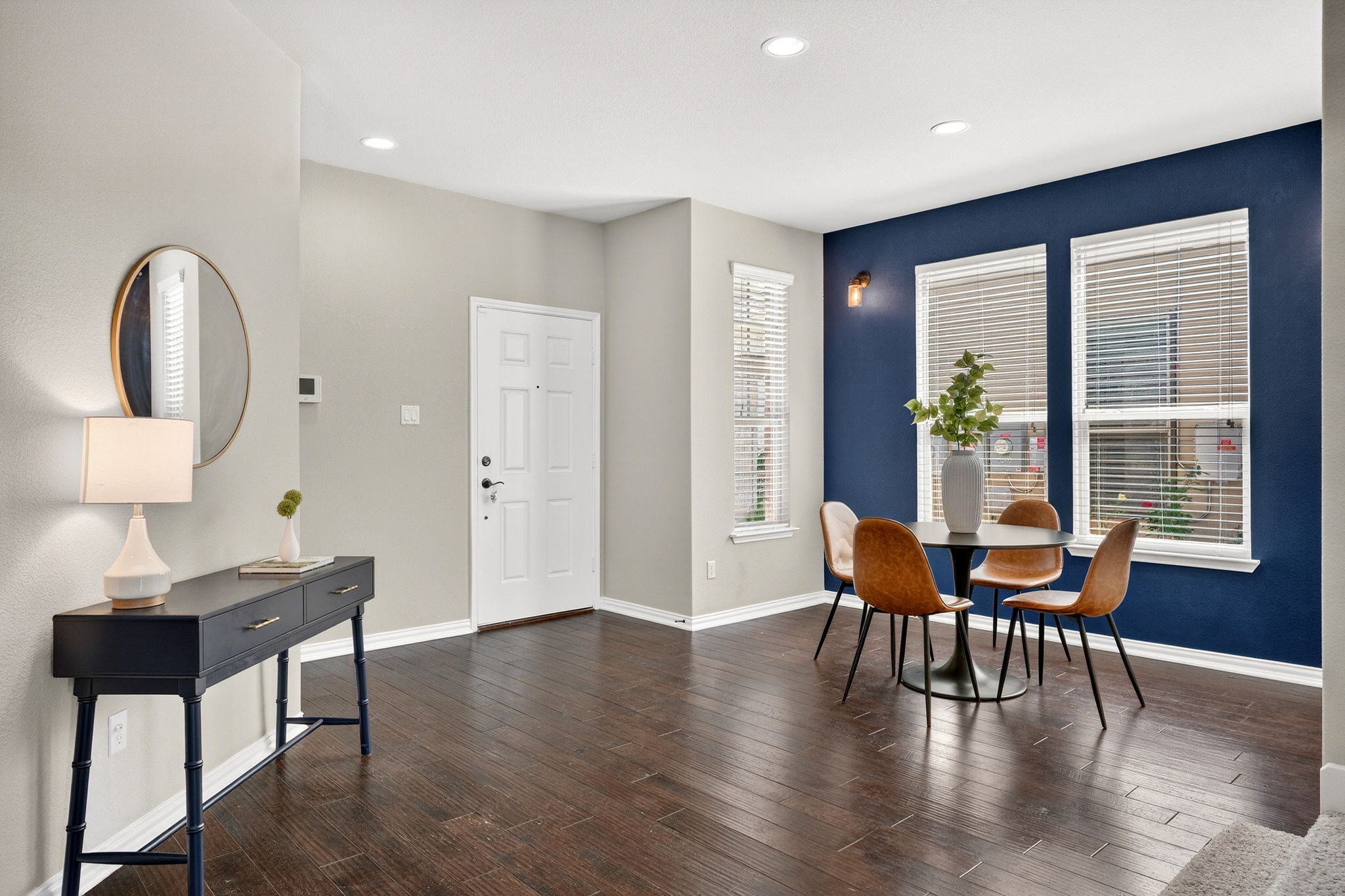 9932 Wading Pool Path Austin, TX 78748 - Photo 12 of 28 Dinner parties just got an upgrade. The navy accent wall creates a sophisticated backdrop for your dining area, beautifully framing the natural light from the oversized windows.