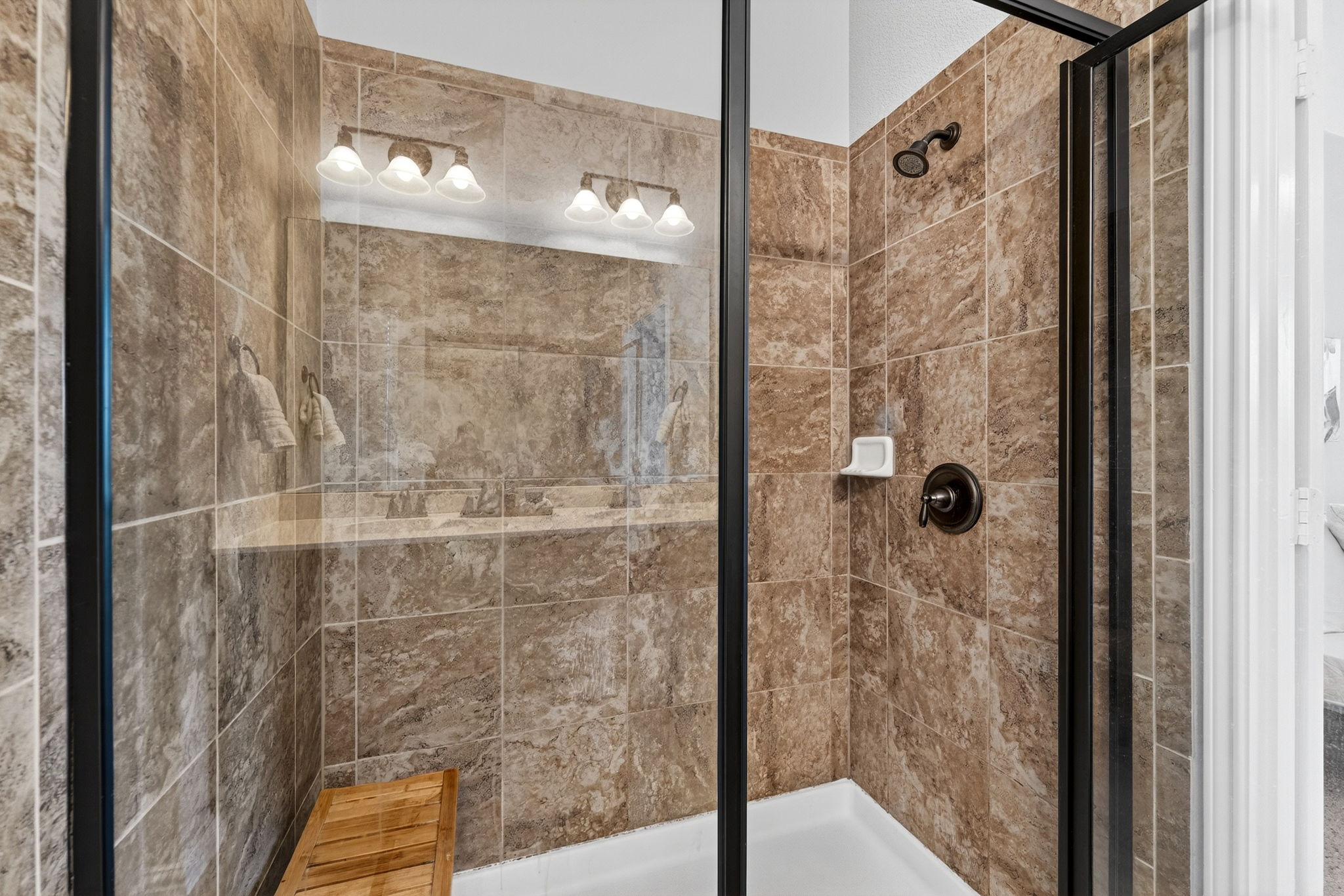 9932 Wading Pool Path Austin, TX 78748 - Photo 17 of 28 The oversized walk-in shower is finished with beautiful neutral tile.