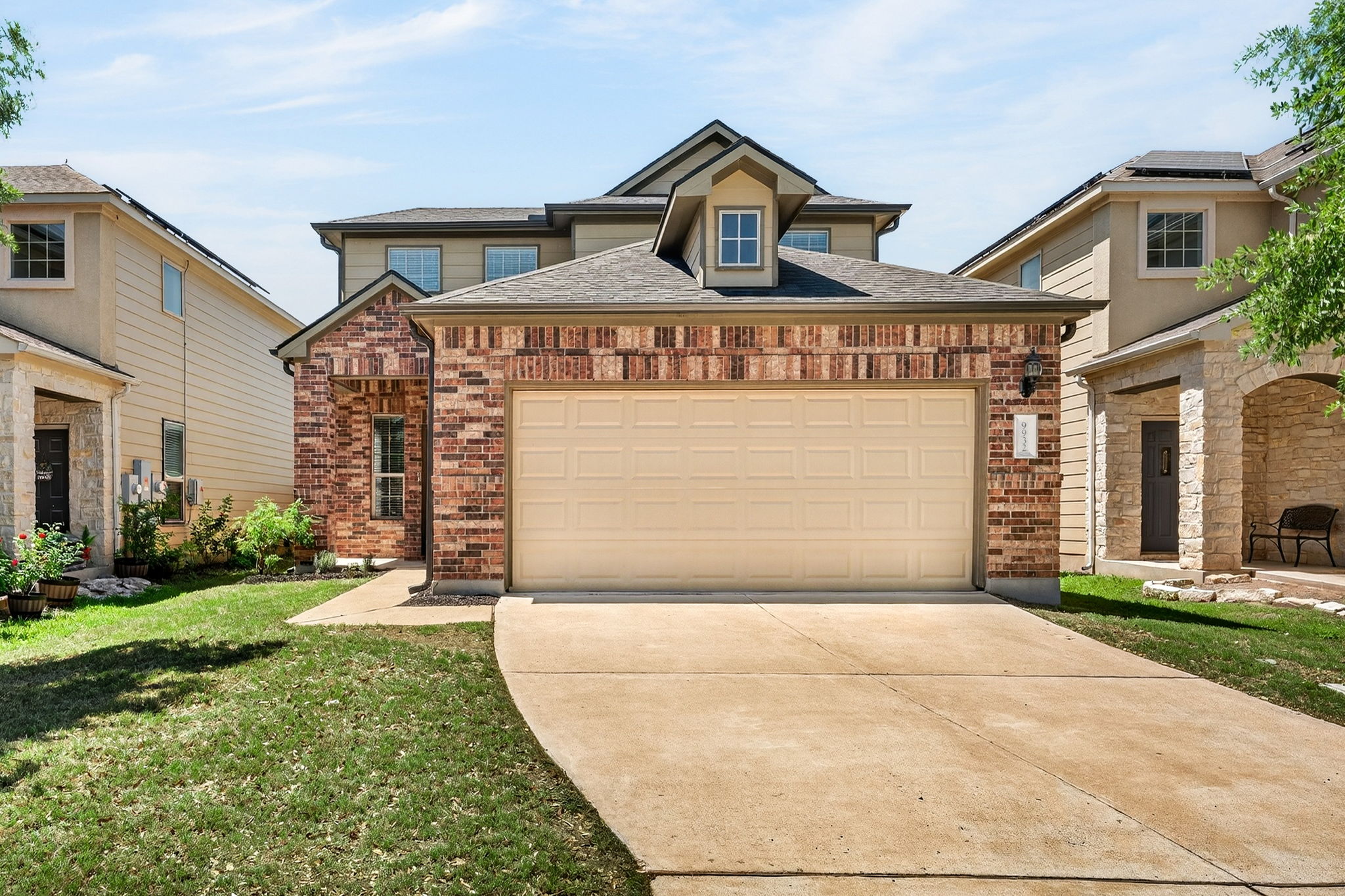 9932 Wading Pool Path Austin, TX 78748 - Photo 2 of 28 First impressions matter, and this one hits all the right notes. The striking combination of rustic brick and crisp siding gives this home an undeniable presence on the block. The two car garage offers plenty of space to park vehicles and for additional storage.