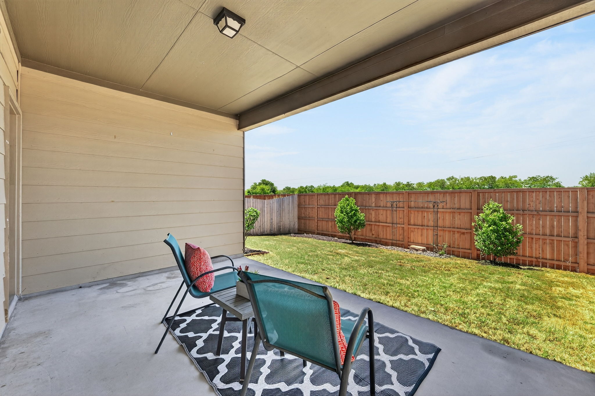 9932 Wading Pool Path Austin, TX 78748 - Photo 25 of 28 Rain or shine, the covered back patio is your go-to spot for relaxation. The deep overhang ensures you stay cool and comfortable while enjoying the Texas breeze.