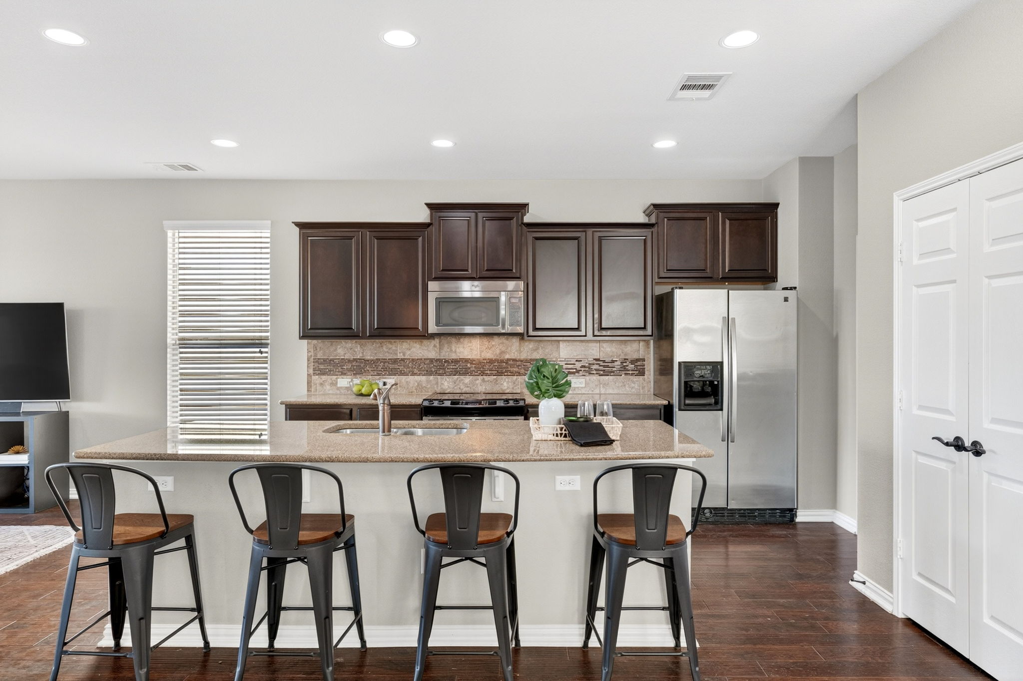 9932 Wading Pool Path Austin, TX 78748 - Photo 7 of 28 The expansive granite island offers tons of prep space.