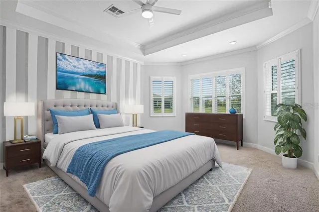 a bedroom with a large bed and a flat tv screen on dresser