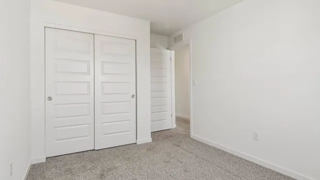 an empty room with closet