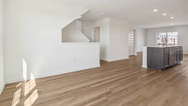a view of kitchen and wooden floor