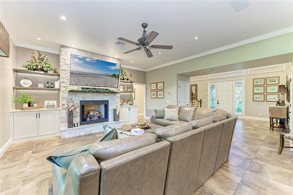 39321 Washington Loop Road Punta Gorda, FL 33982 - Photo 13 of 98 a living room with furniture and a fireplace