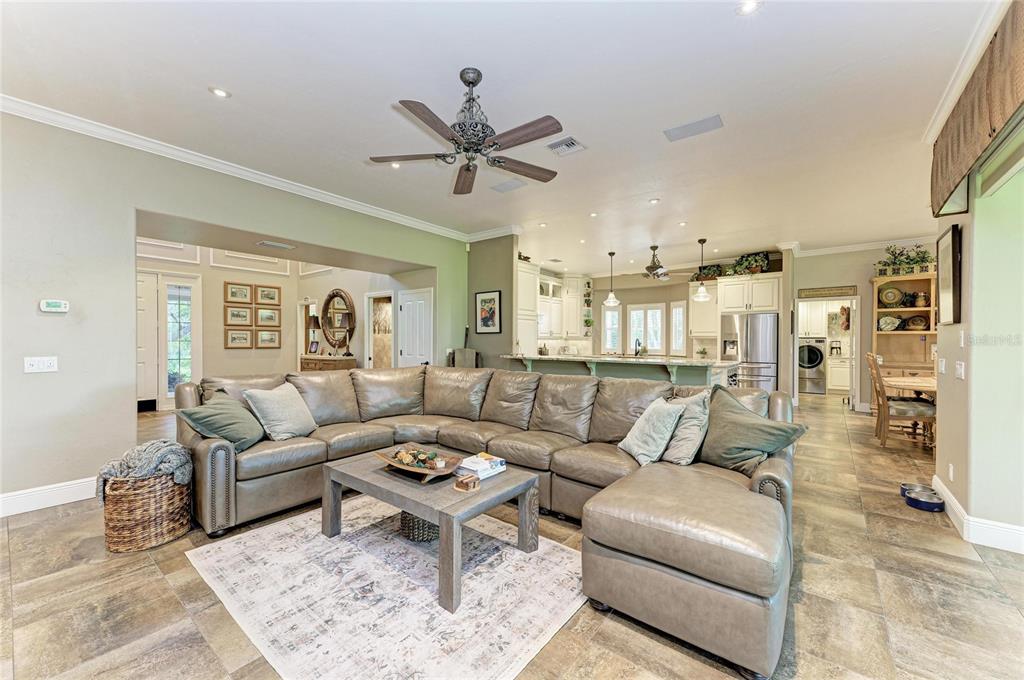 39321 Washington Loop Road Punta Gorda, FL 33982 - Photo 15 of 98 a living room with furniture and a view of kitchen