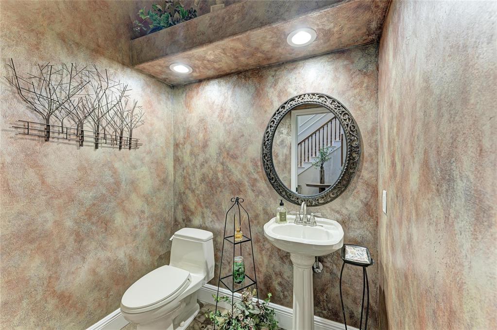 39321 Washington Loop Road Punta Gorda, FL 33982 - Photo 31 of 98 a bathroom with a sink a mirror and a toilet